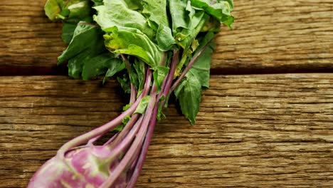 close-up of kohlrabi on wooden table 4k