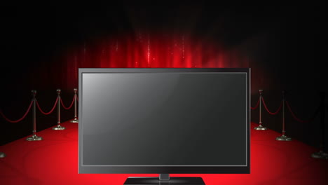 pantalla de televisión sobre alfombra roja y focos en animación de fondo oscuro