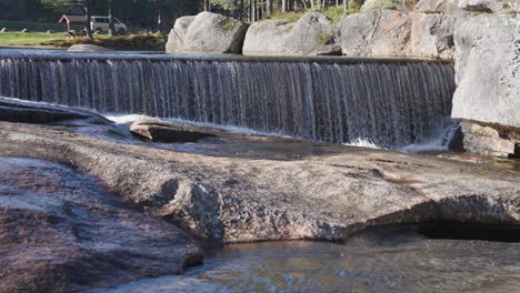 shallow otra river cascades in the rocky riverbed carved by the glaciers