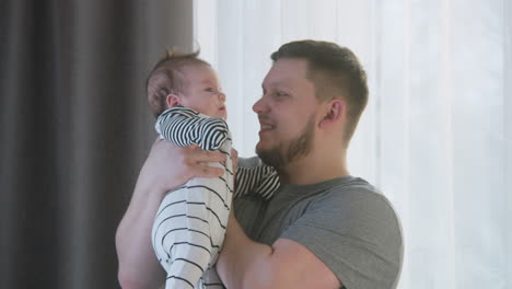 father holding his baby