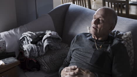 living room scene with a person and remote control