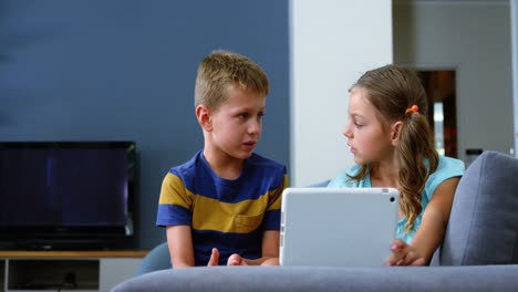 siblings interacting with each other in living room