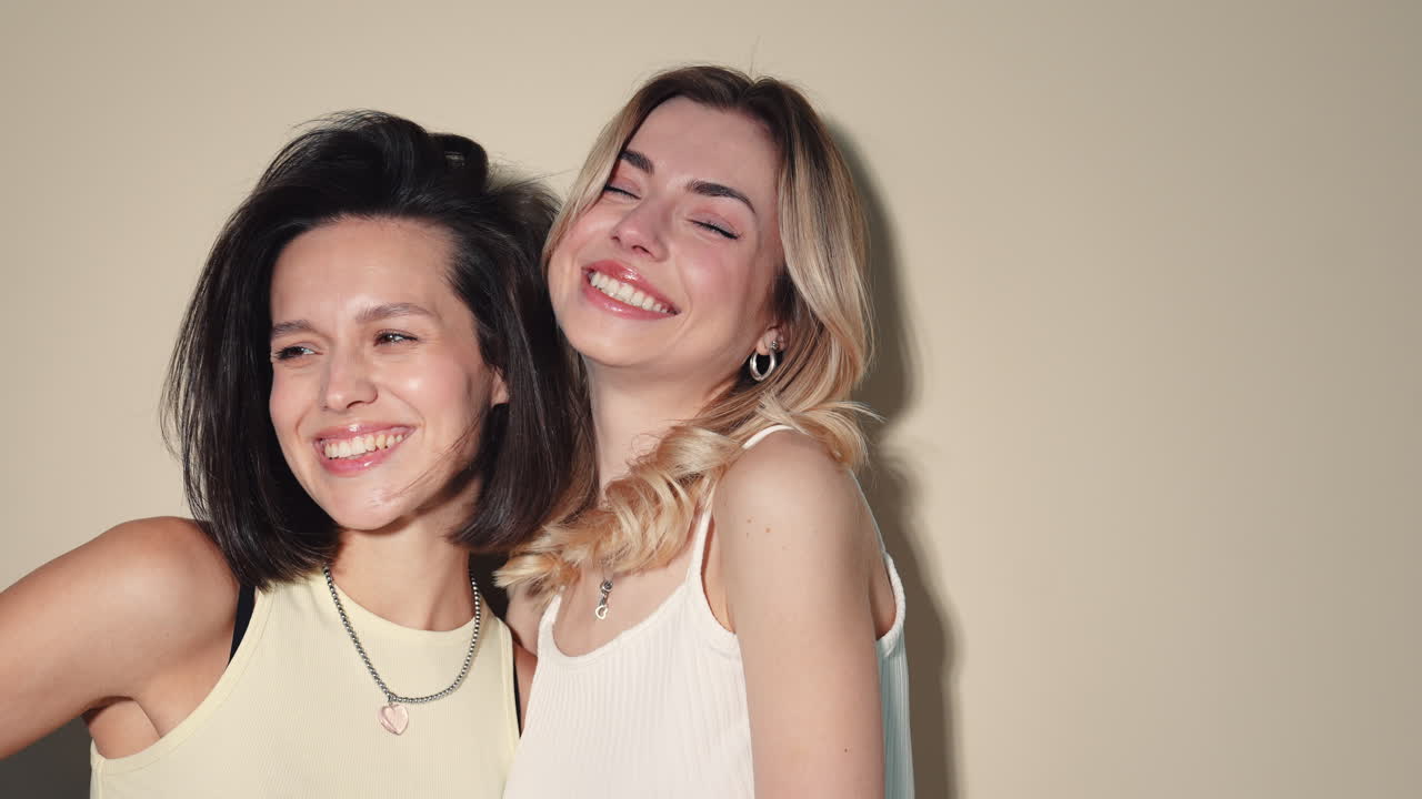 Two happy women posing together