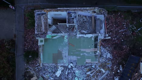 birdseye view of extensive damage and rubble remains of rundown property