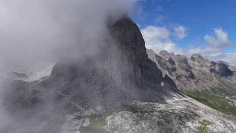 clouds drifting reveal of high mountain peak picos de europa spain