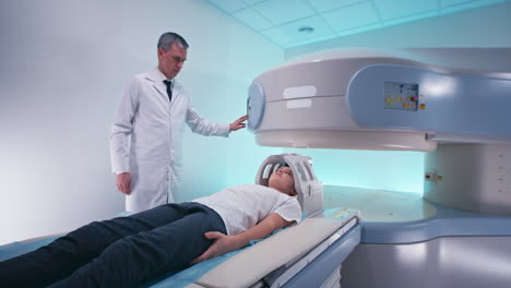 child undergoing mri scan with doctor