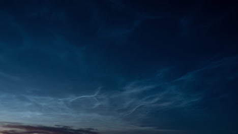 Beautiful-time-lapse-of-silvery-clouds-glowing-and-shining-at-summer-evening,-calm-and-tranquil-scenic-view,-wide-angle-shot