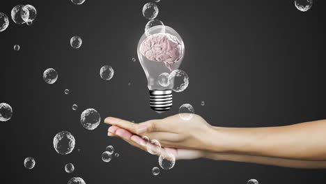 holding light bulb with brain inside, hand surrounded by bubbles animation