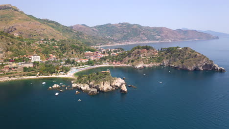 Drone-shot-of-the-Isola-Bella-coastline-with-the-Ionian-Sea