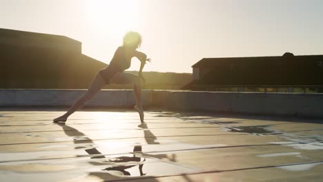 ballet dancer practicing on rooftop