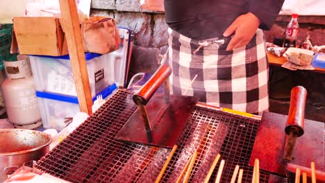 traditional japanese street food grilled barbecue on hot plate in japan.