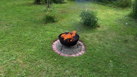 wide shot of burning fire basket