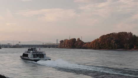 passenger ship sailing on the danube river near vienna upstream