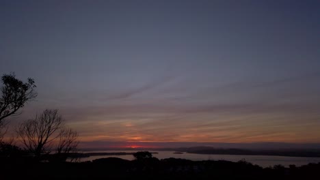 Panning-right-viewing-beautiful-sunrise-sunset-over-the-hill