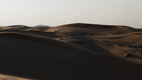 Slow-motion-sand-blowing-in-a-desert-in-middle-east