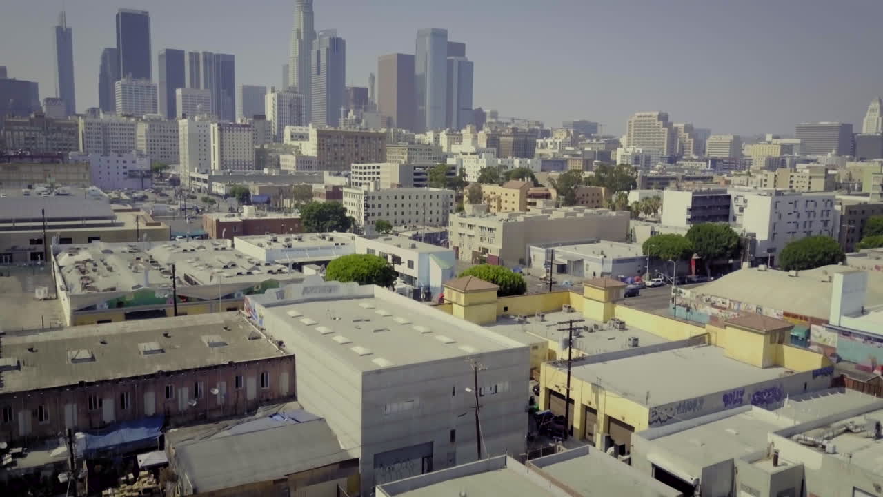 Aerial View of Urban Los Angeles Cityscape with Skyscrapers and Industrial Buildings