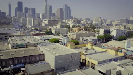 aerial view of urban los angeles cityscape with skyscrapers and industrial buildings