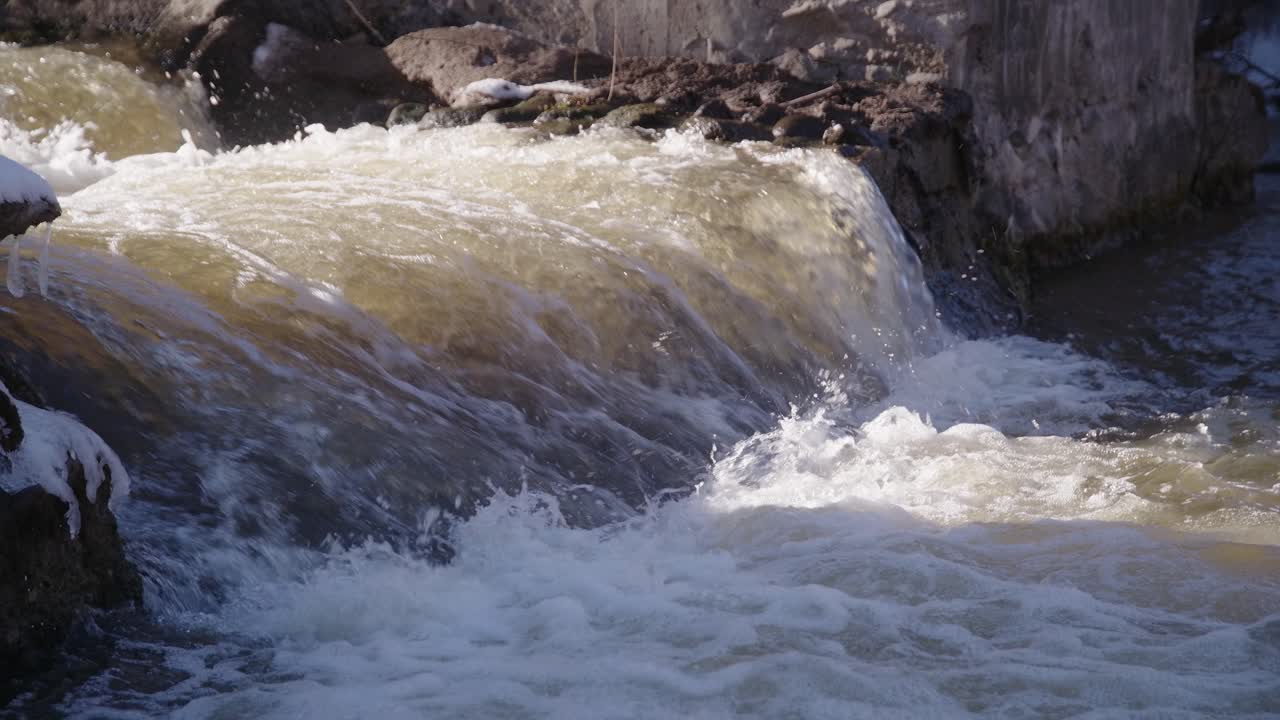 50 FPS Strong Current Falls from Cascade Waterfall in a River on a Bright Day