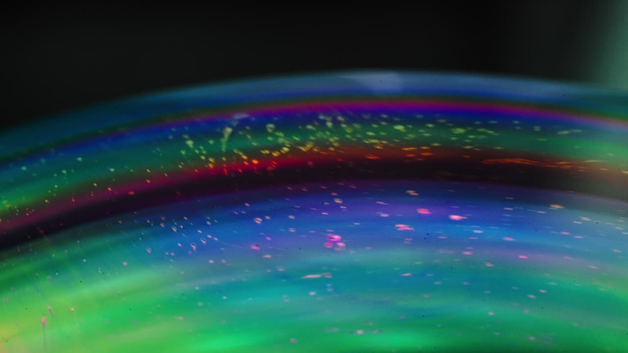 abstract swirling patterns on iridescent soap bubbles