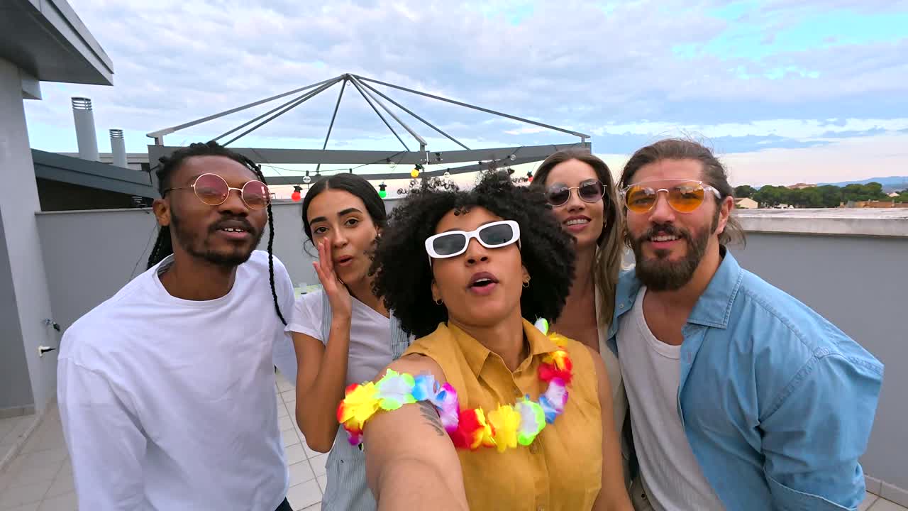 Group of Friends Taking a Selfie at a Rooftop Party