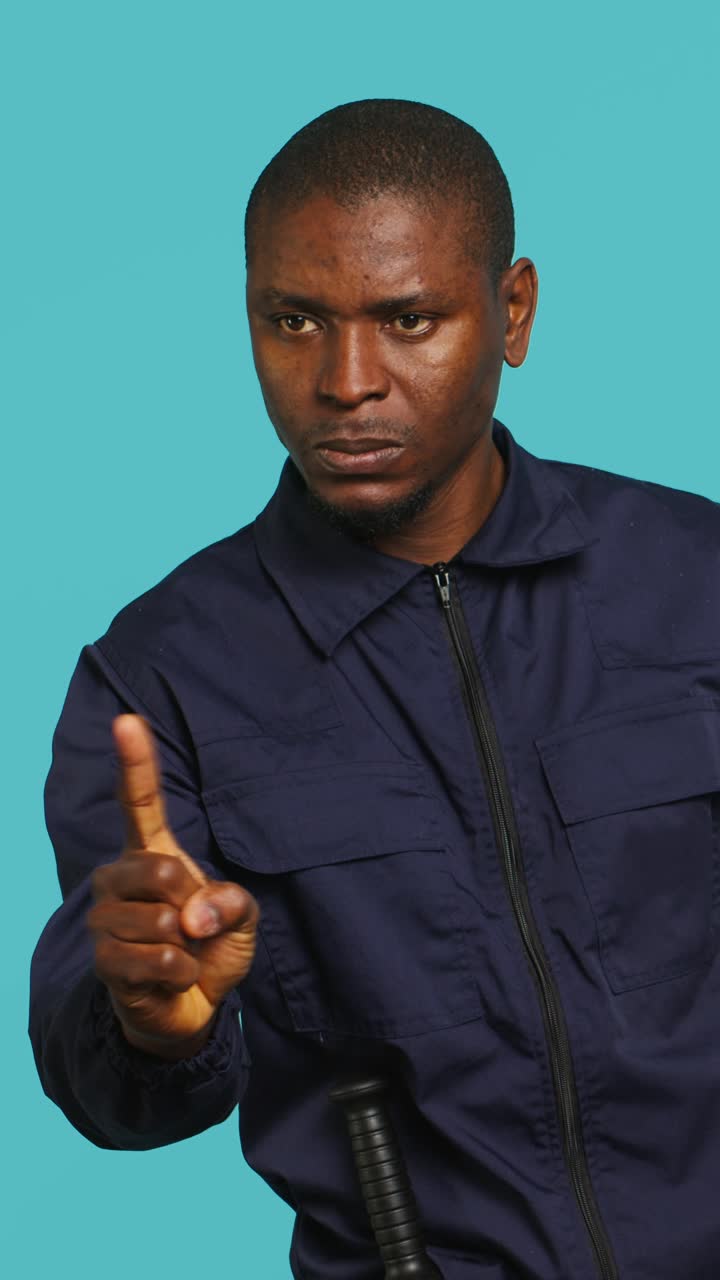 African American Man Shaking Head and Warning with Finger
