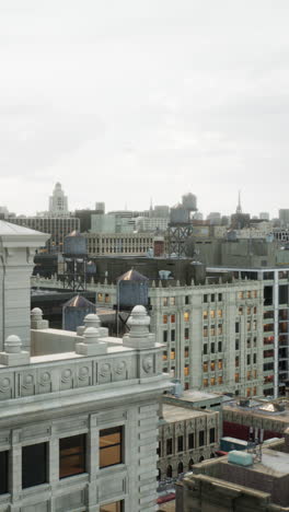 aerial view of a cityscape with water tanks on rooftops