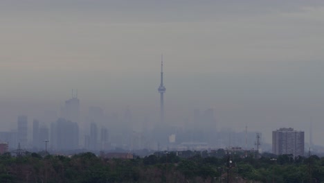 toronto skyline shrouded by grey fog. time-lapse