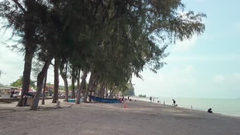 Cinematic-footage-of-Pantai-Puteri-Beach-in-Melaka,-Malaysia,-during-a-partly-cloudy-day