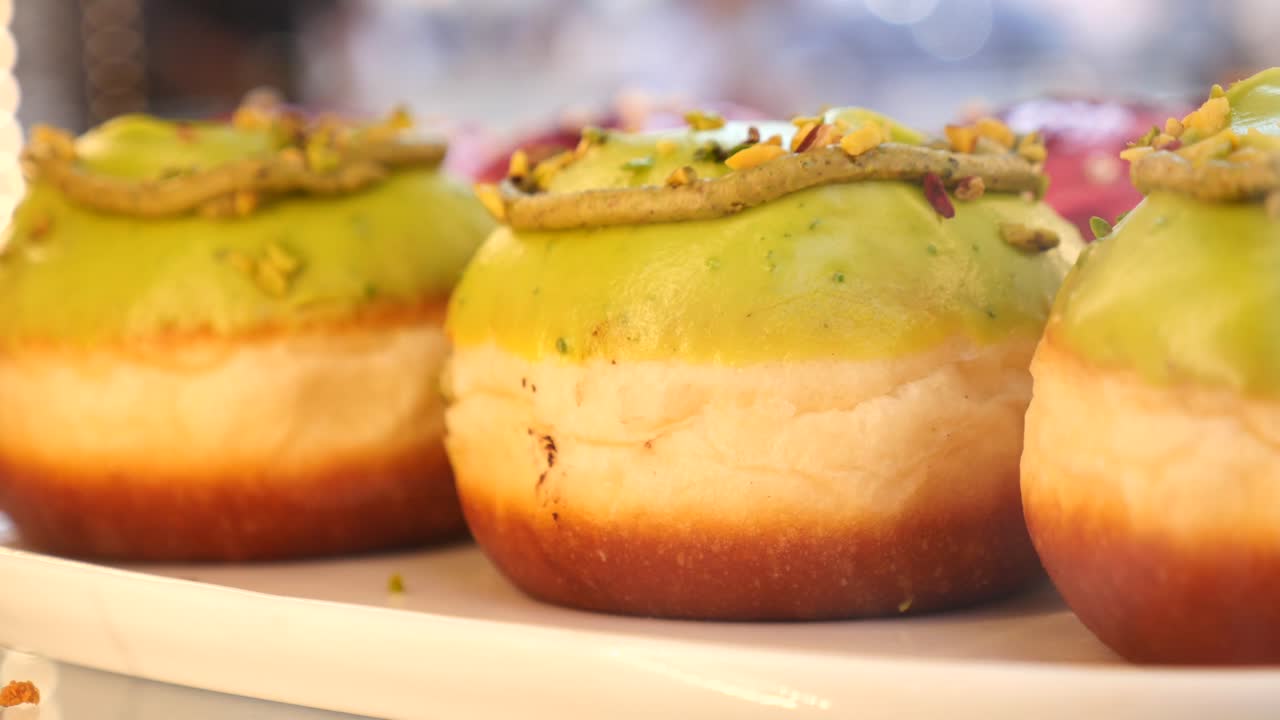 Pistachio-frosted donuts