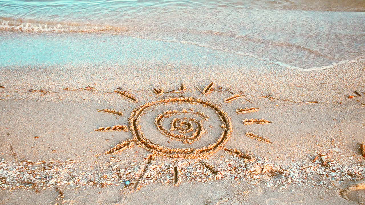 Sun drawing on the beach. Beach and drawing