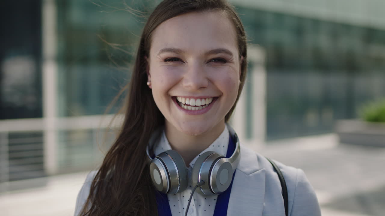 portrait of beautiful young lively woman smiling at campus intern laughing office corporate outdoors