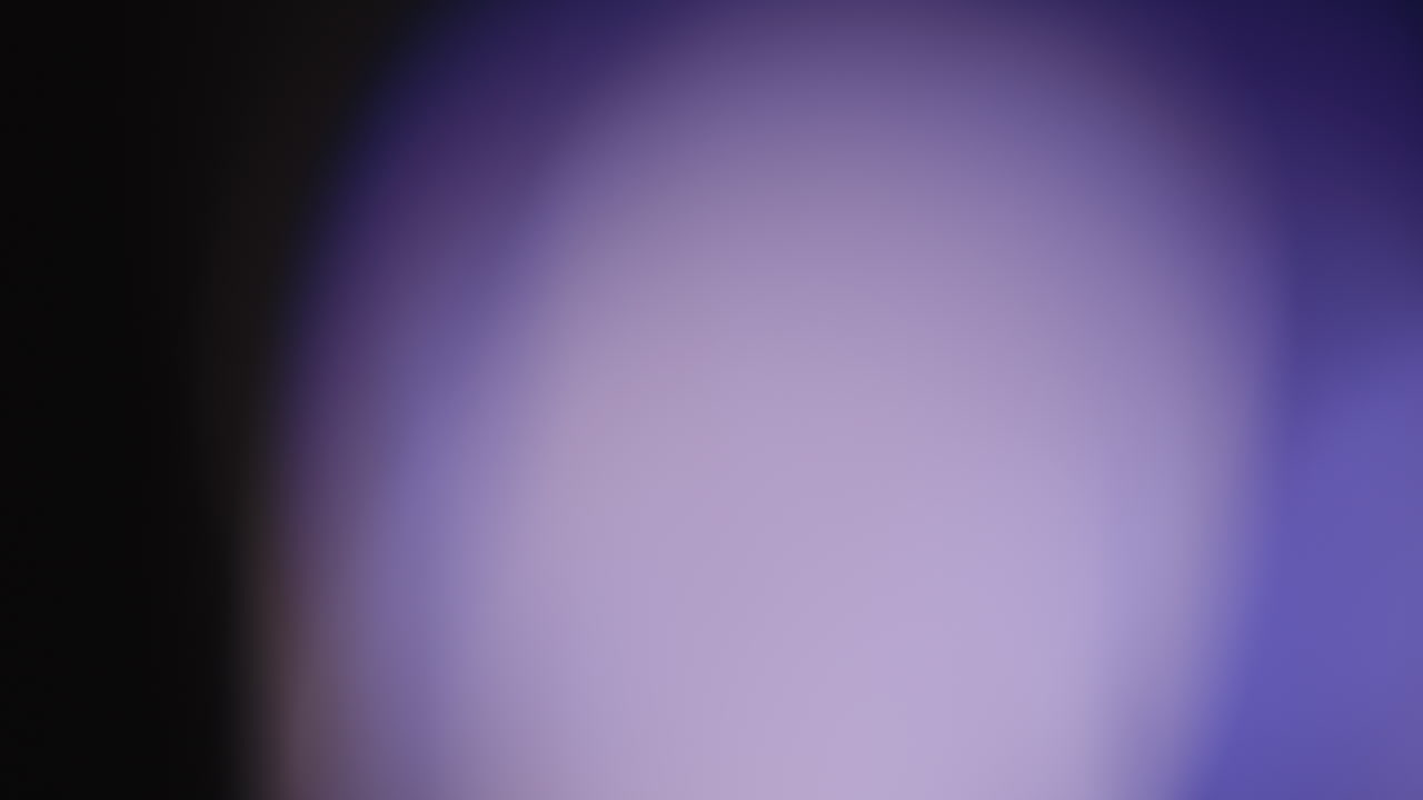 Multicolored light leaks 4k footage on black background stylizing video transitions bokeh effect