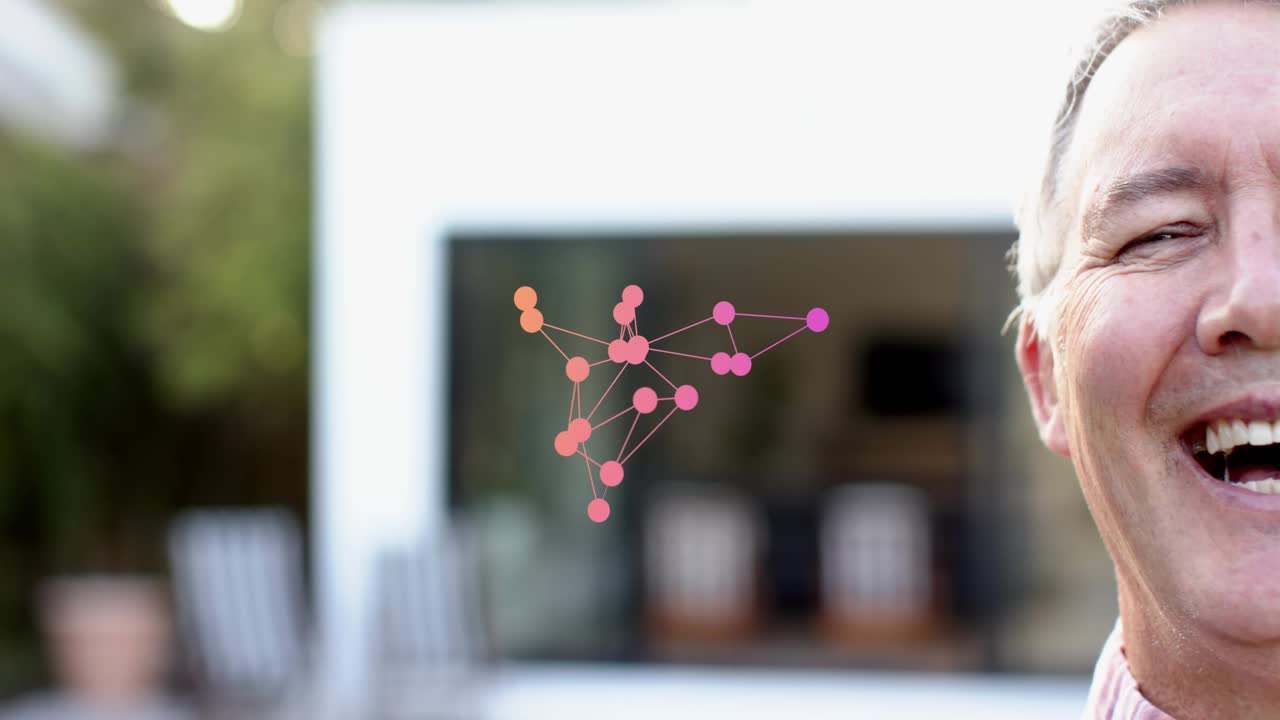 Senior man in backyard tech points appearing linking into pink network touching cheek causing smile