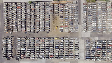 overhead view of people looking for used cars