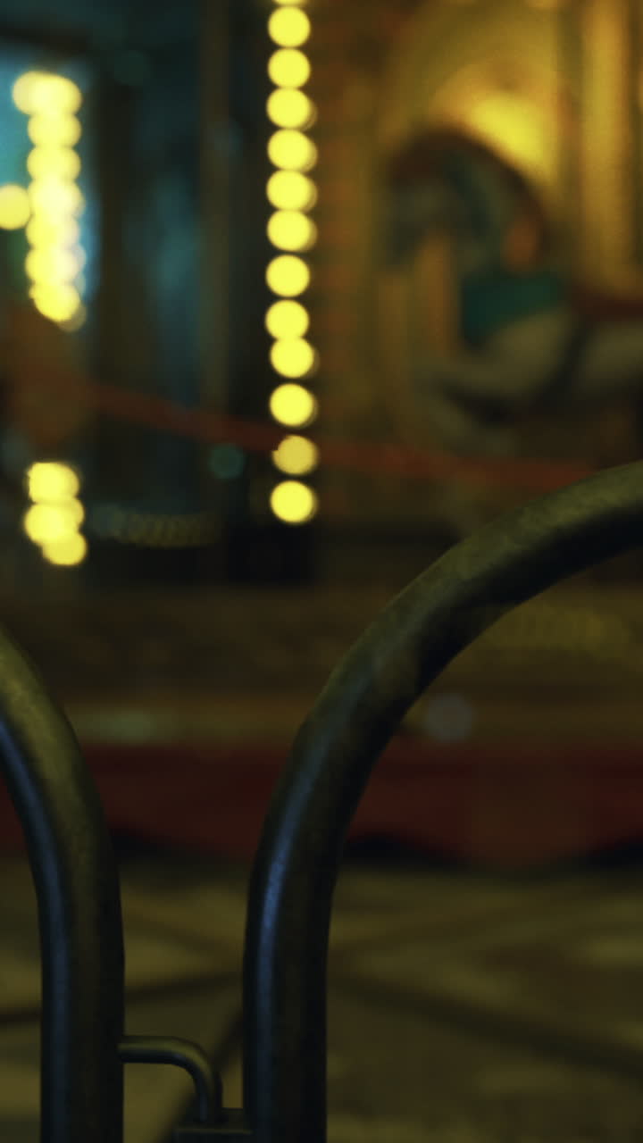 Empty carnival atmosphere with lights and a carousel at night
