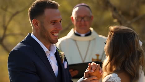 wedding ceremony with groom, bride, and priest