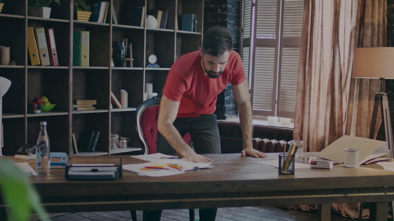 Sad business man moving paper from table and taking out bottle of whiskey