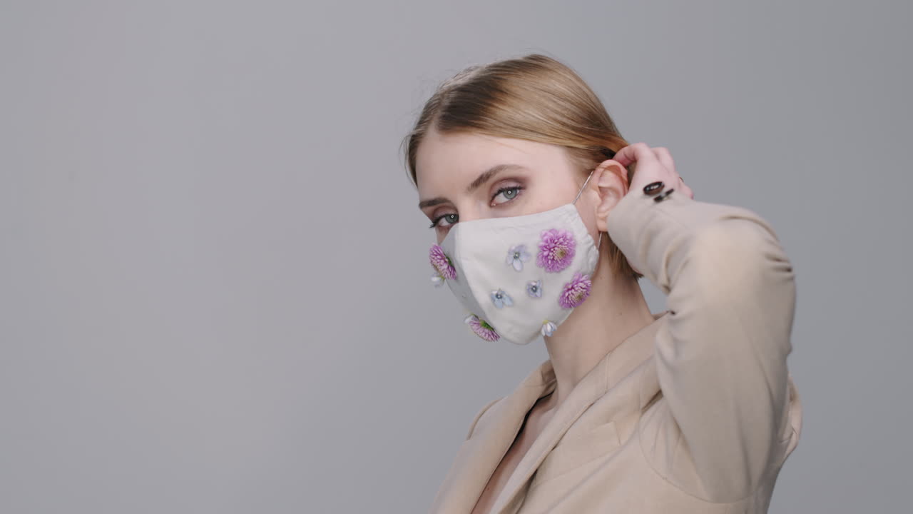 Portrait of Woman in Face Mask with Flowers Posing