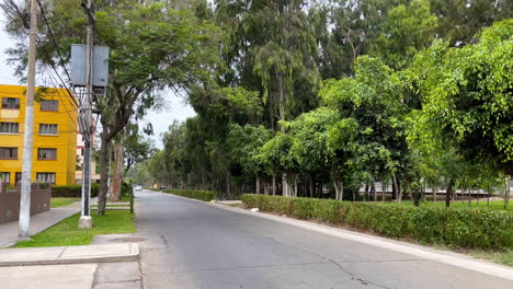 a static shot of a clean asphalt road and it's surrounding in lima, peru