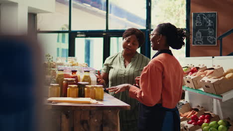 merchant presenting homemade sauces and spices to client