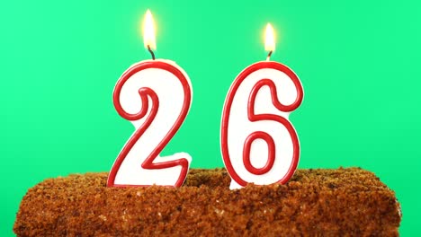 cake with the number 26 lighted candle. chroma key. green screen. isolated