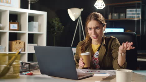 young lady drinking coffee indoors.