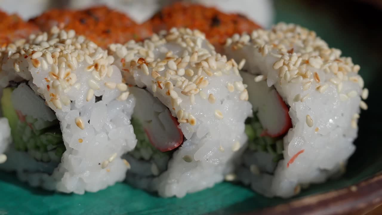 Close-up of Sushi Rolls with Sesame Seeds