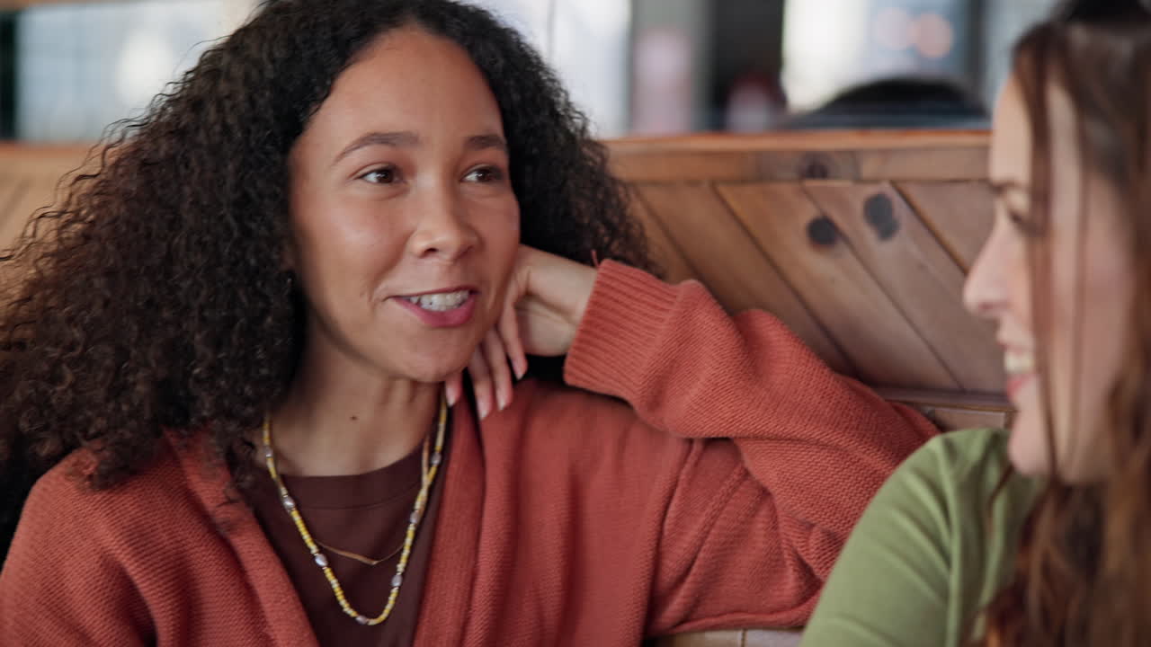Women friends, chat and listening in coffee shop
