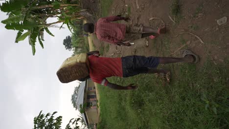 Two-African-children-carrying-water-cans-in-Africa-4K