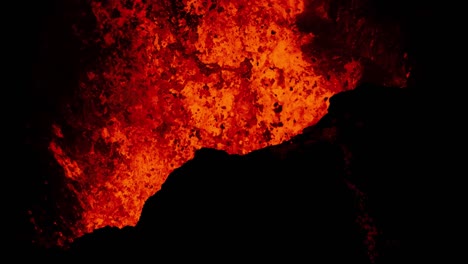 Blasting-hot-molten-lava-from-active-volcano-crater,-splashing-magma