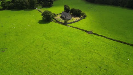 the legendary st bega’s church, bassenthwaite, lake district, full of folklore - aerial drone gimbal down, reveal church, zoom in then anti-clockwise rotate