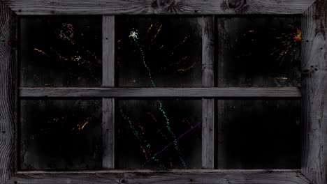 animation of window with colourful christmas and new year fireworks exploding on black background