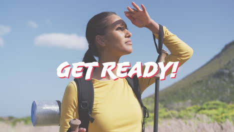 Animation-of-the-words-get-ready-in-white-over-happy-woman-hiking-in-mountains