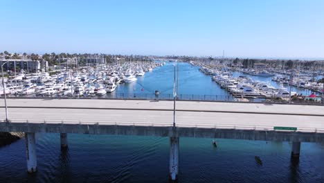 rising aerial of oxnard harbor with boats yachts and marina california